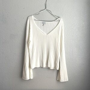 Cream bell sleeves top by sofia Vergara